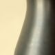 Two-handled vase, black and yellow glazed, in the style of Pol Chambost.