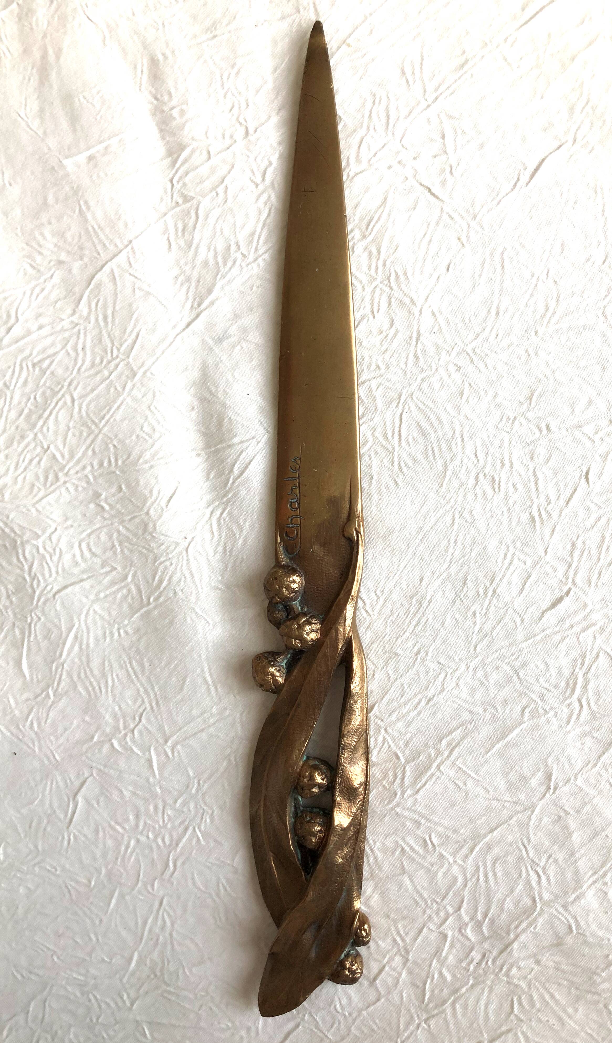 Opens letters cut bronze paper signed