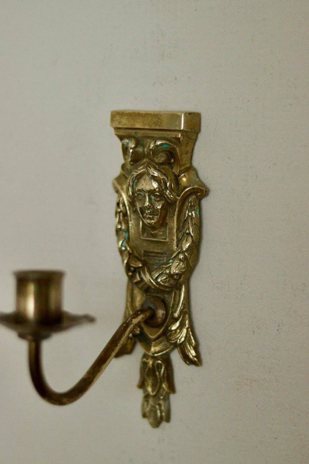 Pair of mid-century Swedish brass face motif sconces