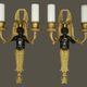 Pair of winged putti wall sconces in Louis XVI style - gilded bronze and black patina