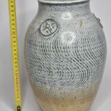 Stoneware vase signed by Sylvie Dufour, incised decoration and relief medallions, 28 cm.