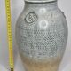 Stoneware vase signed by Sylvie Dufour, incised decoration and relief medallions, 28 cm.