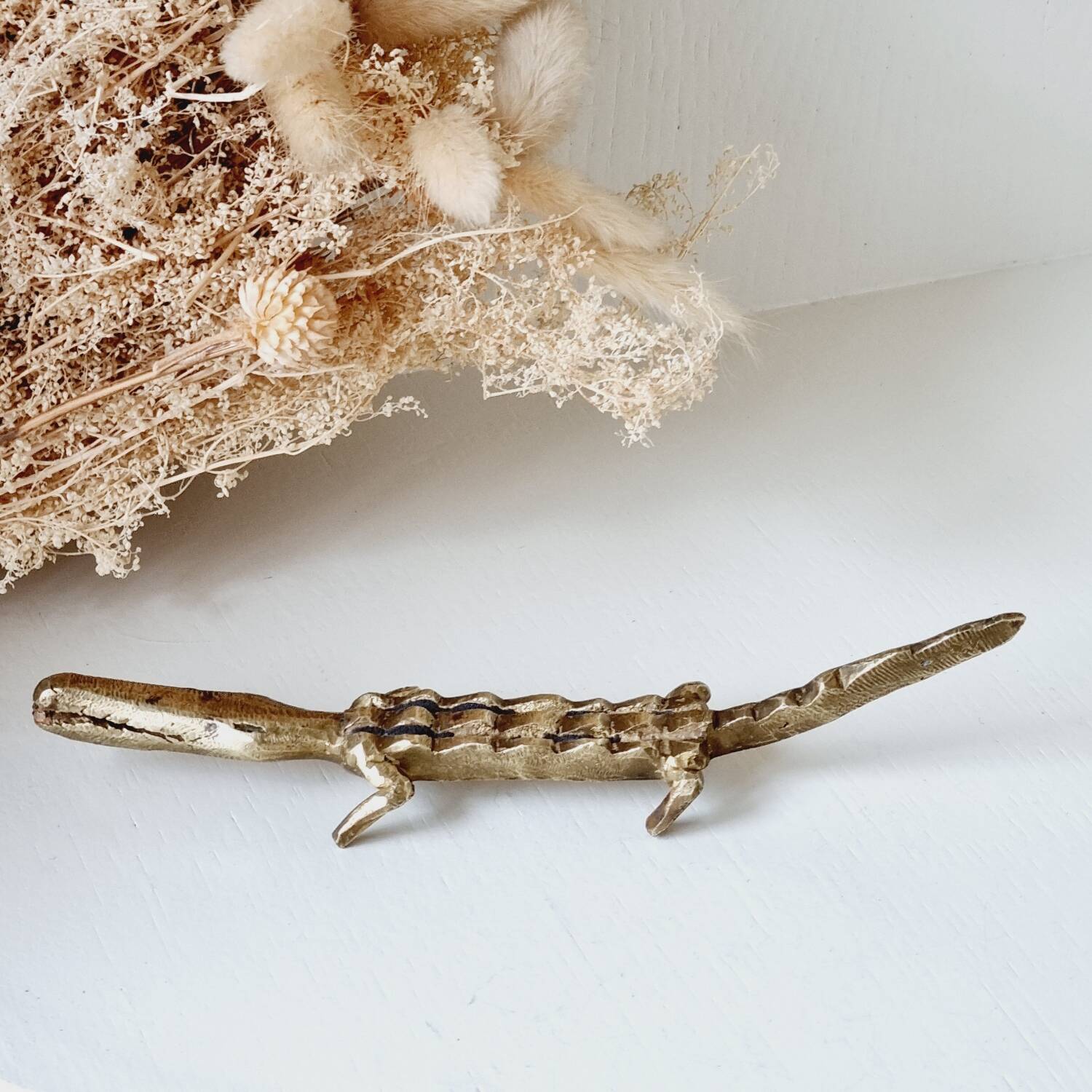 Stylized brass crocodile