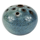 Vase with blue flowers.