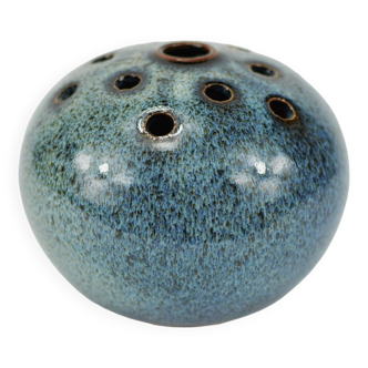 Vase with blue flowers.