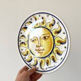 Decorative ceramic plate with sun face