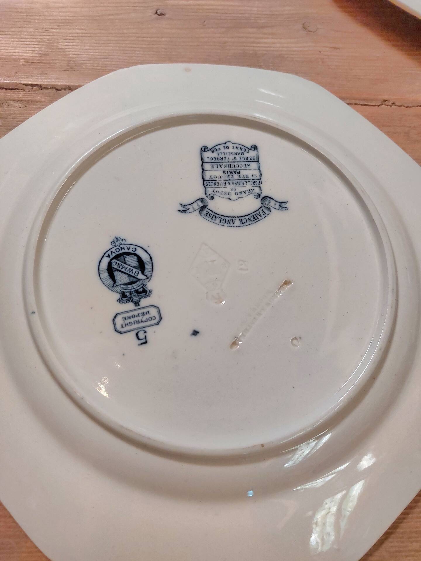 Set of three blue ironstone flat plates.