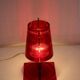 Red plastic Kartell table lamp - model Take - design by Ferruccio Laviani