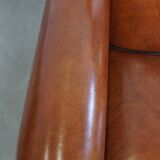 Very beautiful complete set consisting of a sheepskin leather sofa and two armchairs in cognac color