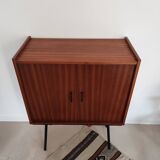 Piece of furniture on high feet metal compass