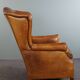 Wingback chair made of sheepskin leather in a light honey color