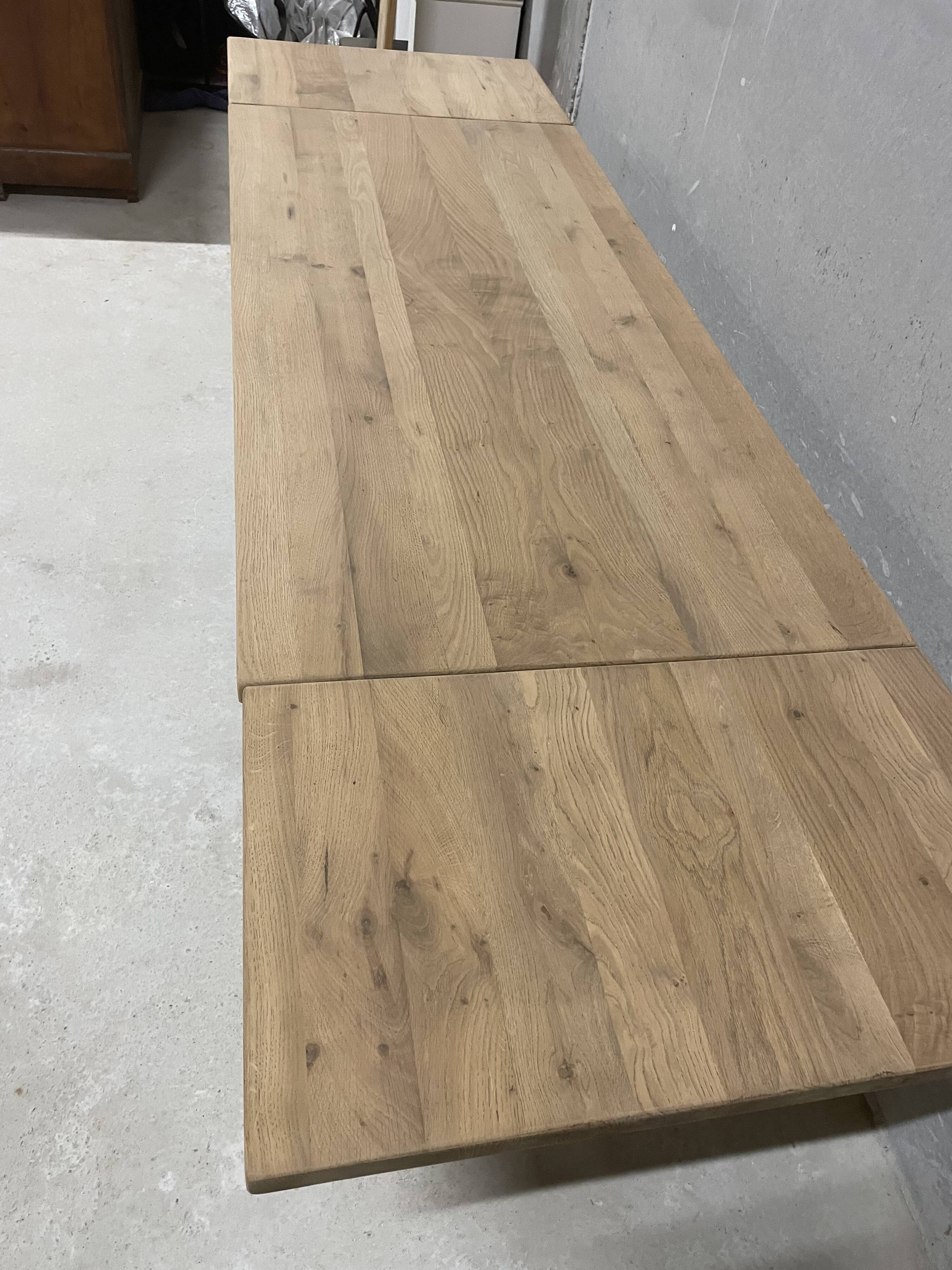 Large solid wood table with extensions – elegant and friendly