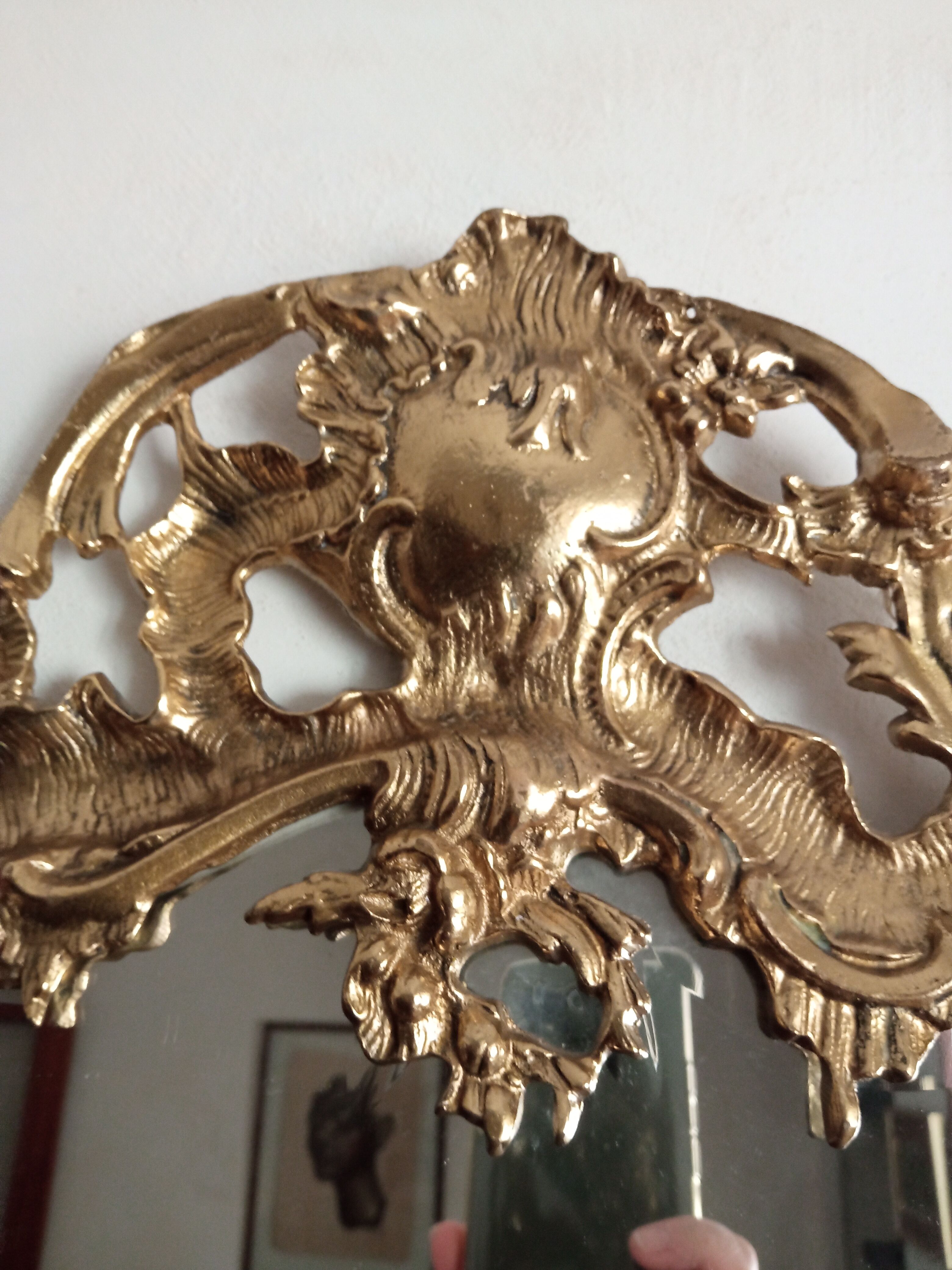 Antique mirror in gilded metal
