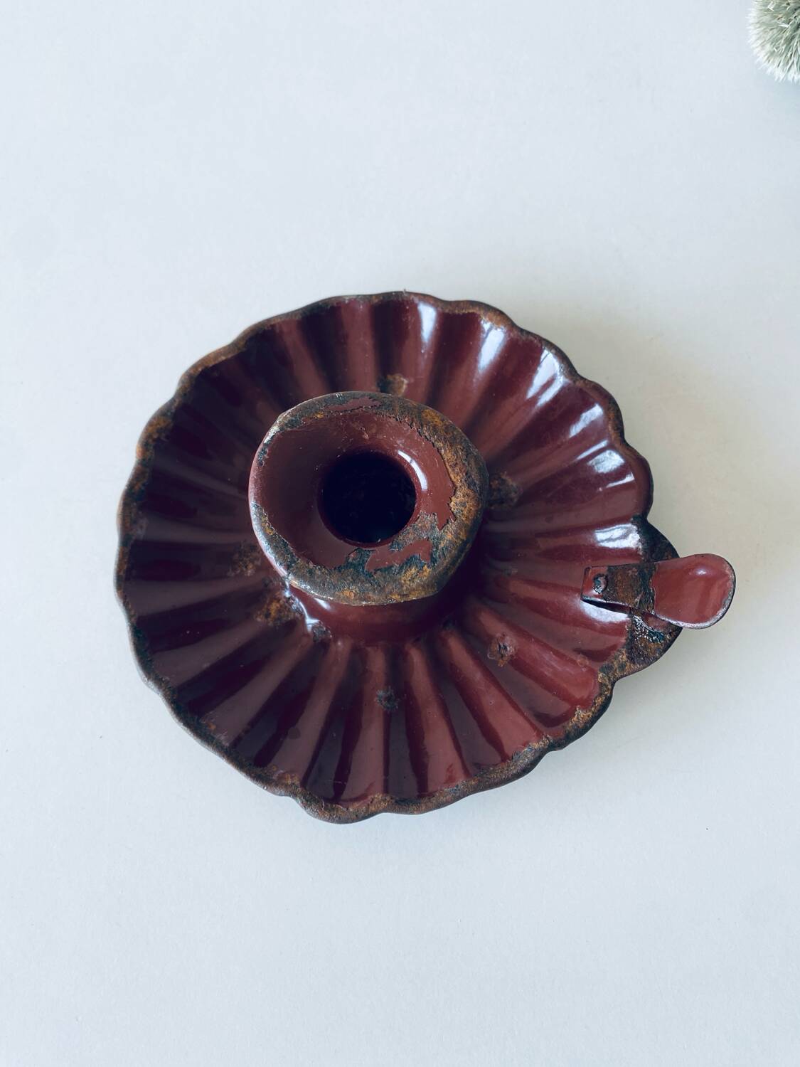 Antique enamelled candle holder