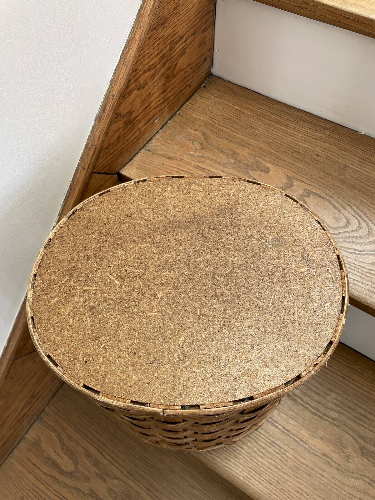 Oval wicker and wood woven wastepaper basket