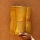 Sculptural wall light in yellow ceramic