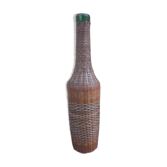 Glass and wicker bottle