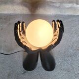 Black and white opaline hand lamp.
