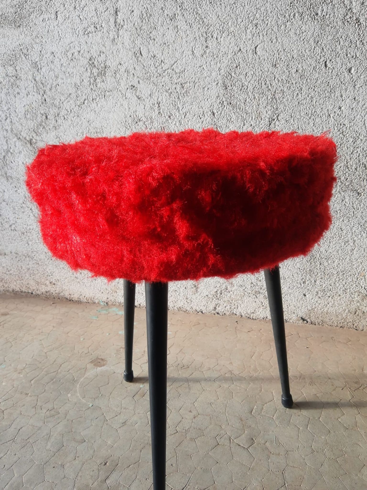 Tripod stool with vintage red moumoute seat