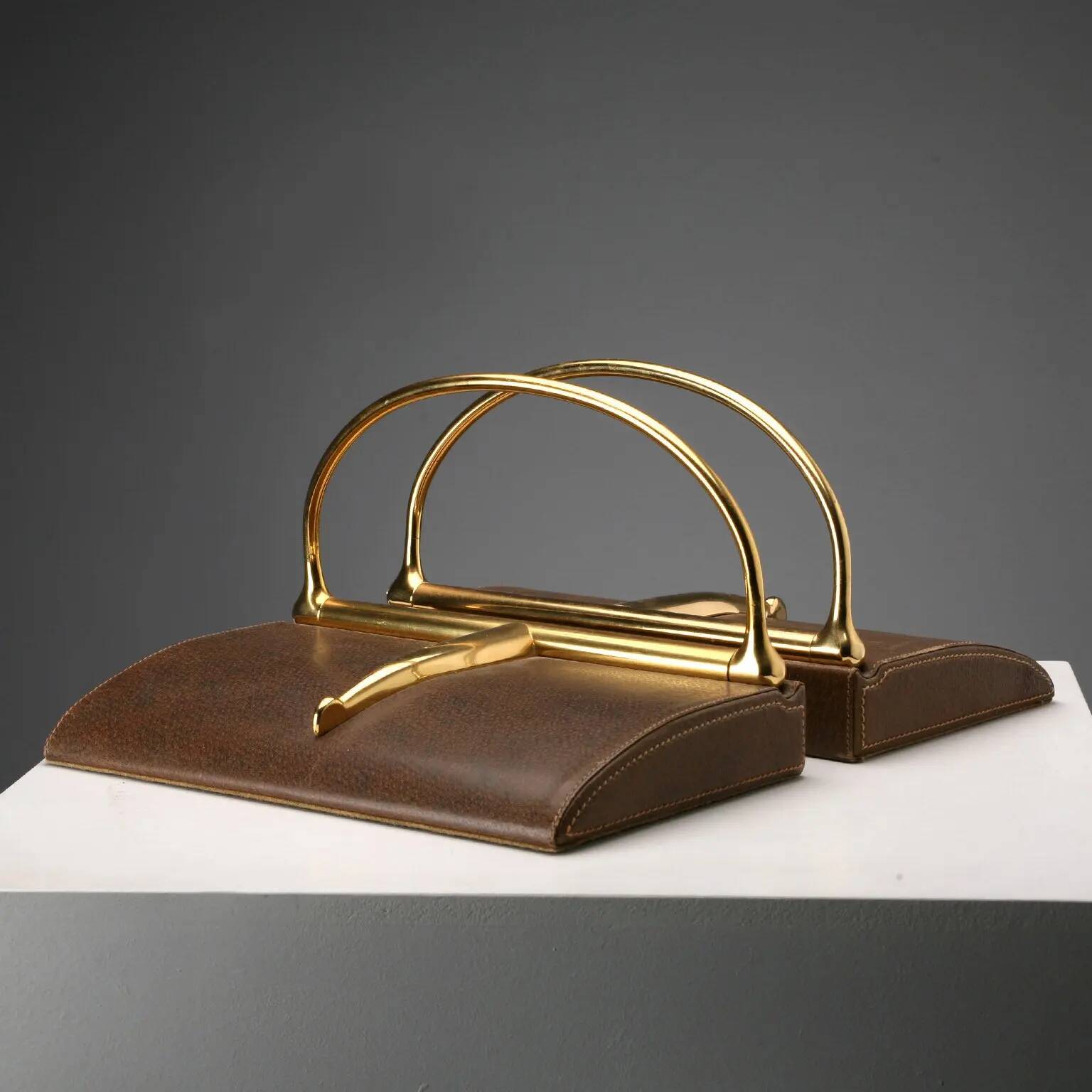 Vintage Gucci bookends in leather and brass, Italy, 1970s.