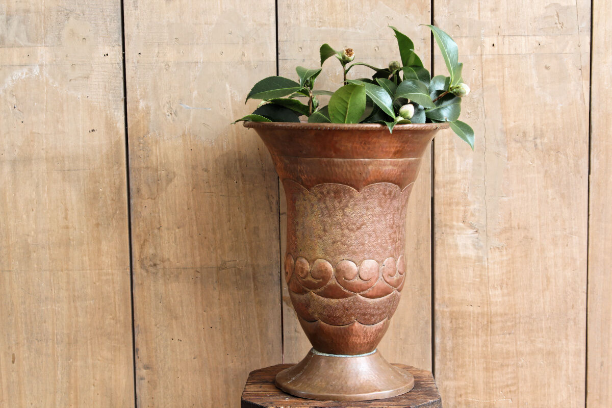 Copper vase hammered on pedestal