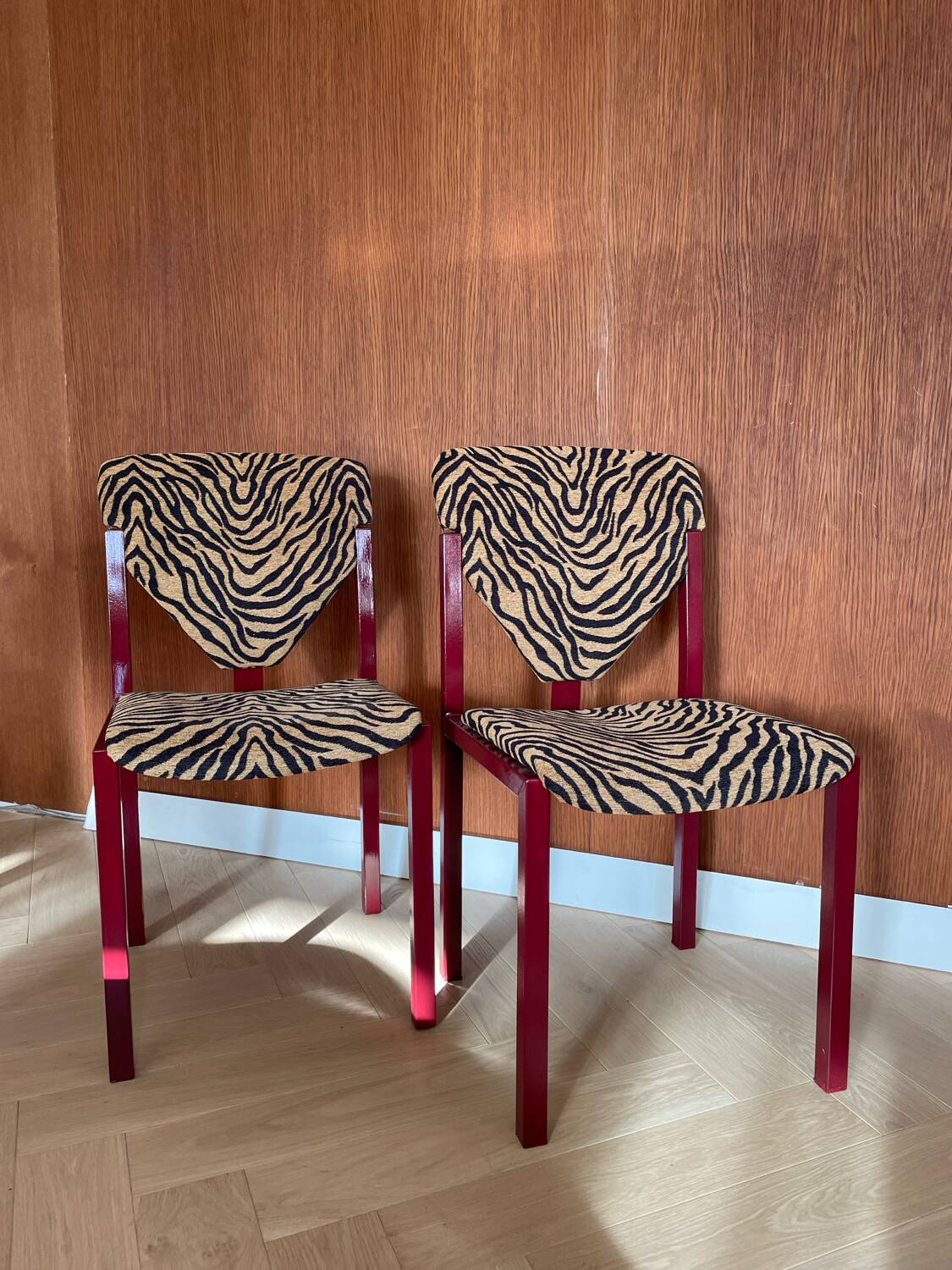 4 red lacquered zebra chairs