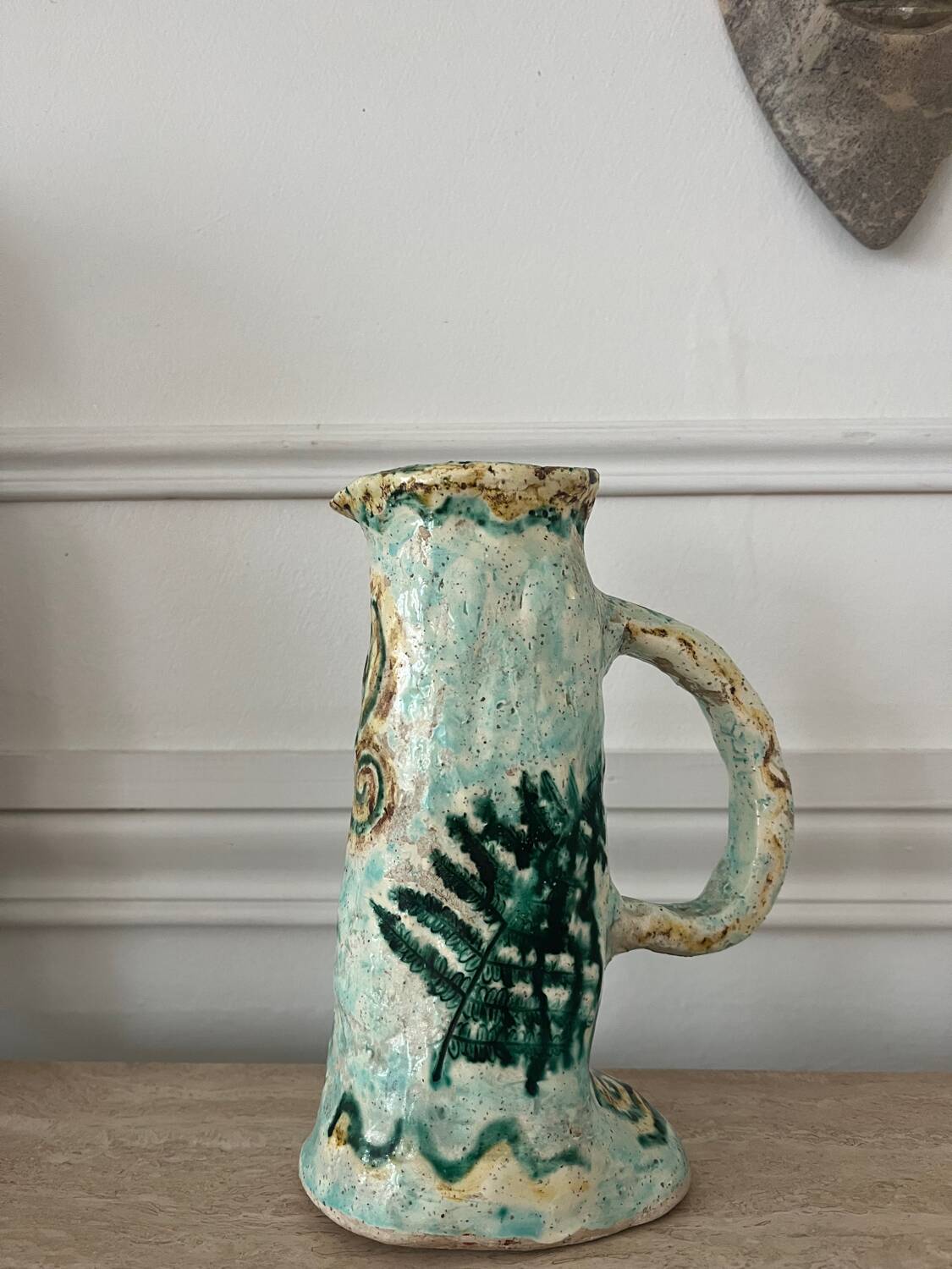 Antique handcrafted ceramic pitcher
