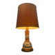 Vintage orange Portuguese table lamp with a ceramic base.