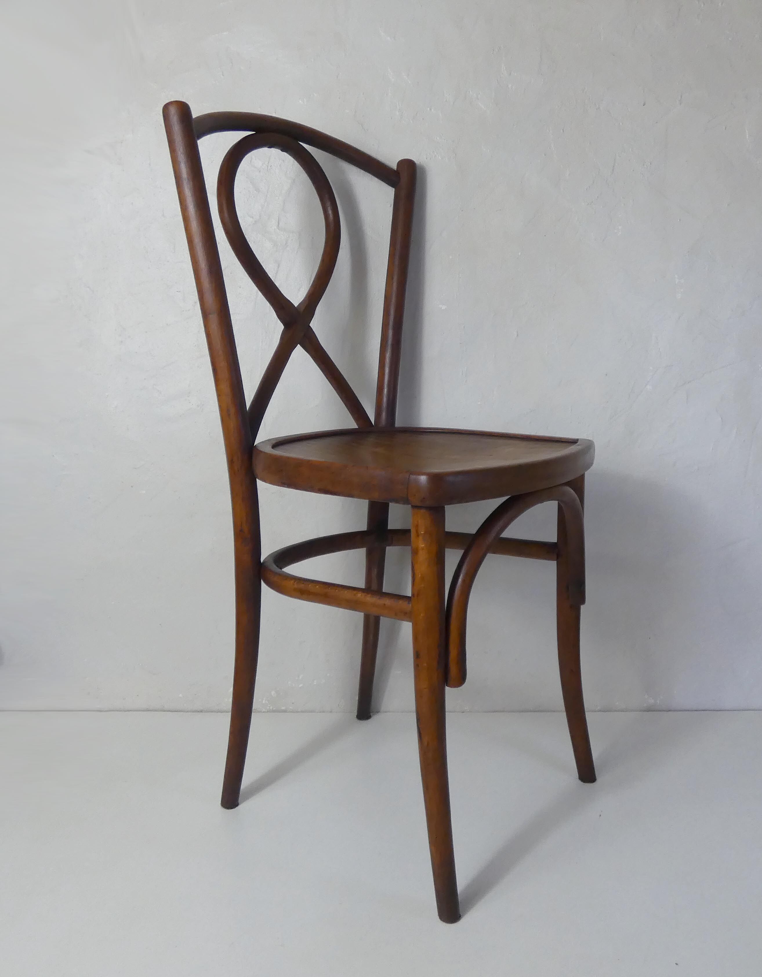 Old curved wooden bistro chair