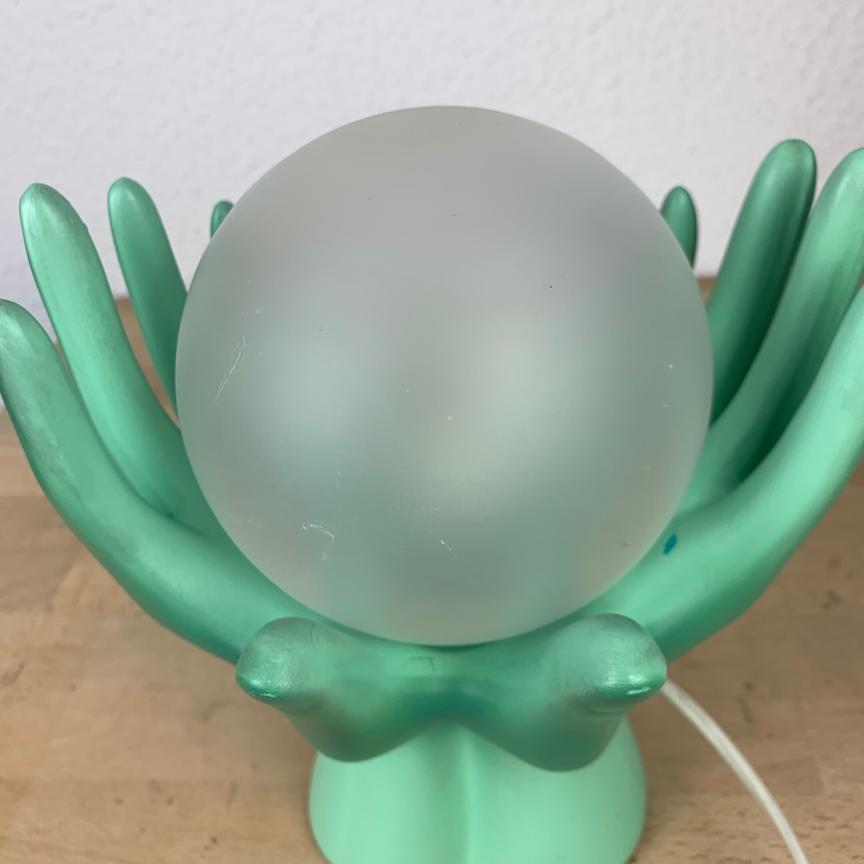 Green ceramic hand lamp and glass globe