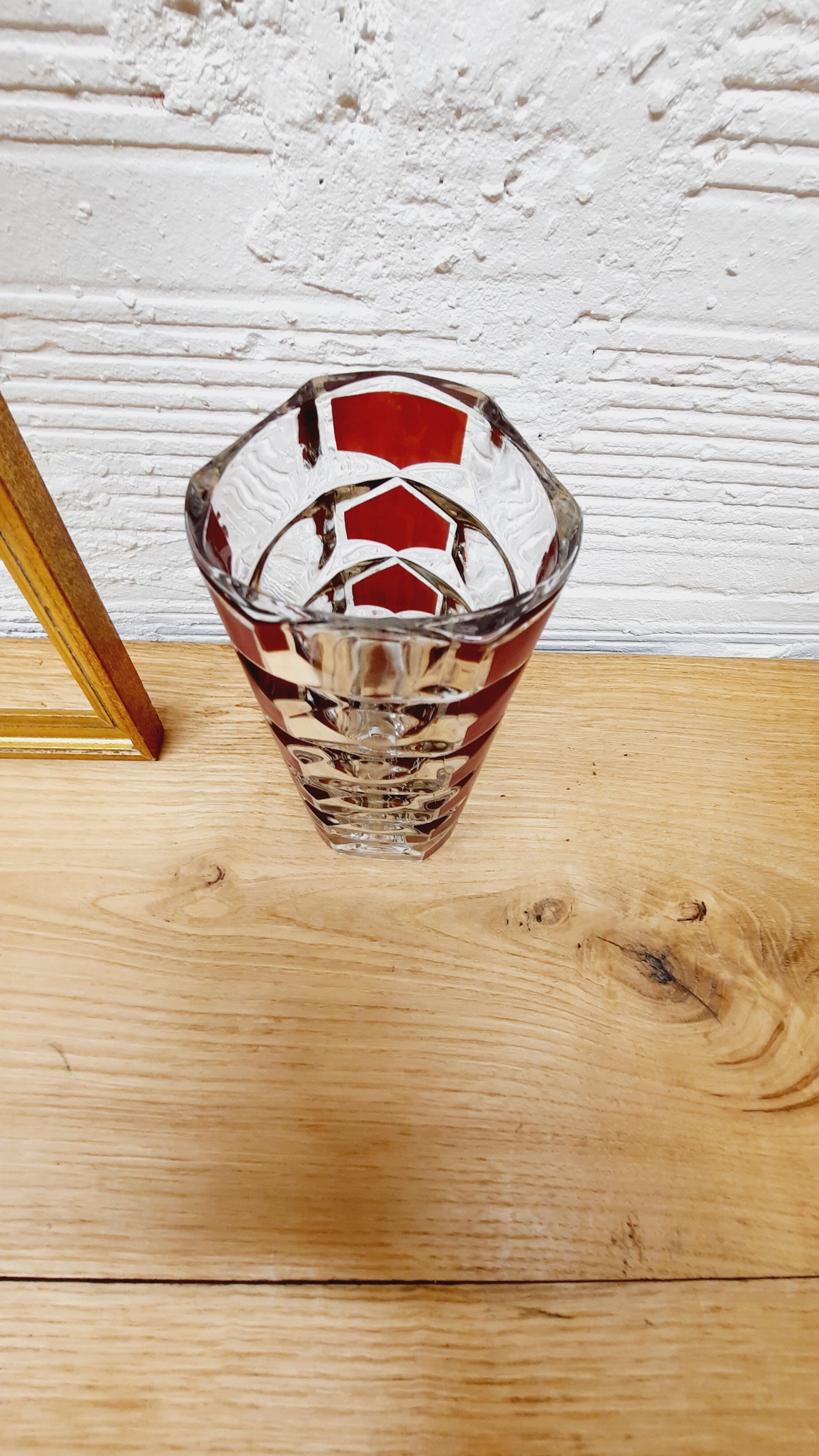 Glass vase with colored facets