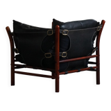 "Lounge chair 'Ilona' by Arne Norell in stained beech and leather, mid-20th century."