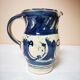 Enamelled ceramic blue pitcher signed by the artist