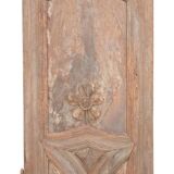 Porte de placard en bois panneauté et sculpté
