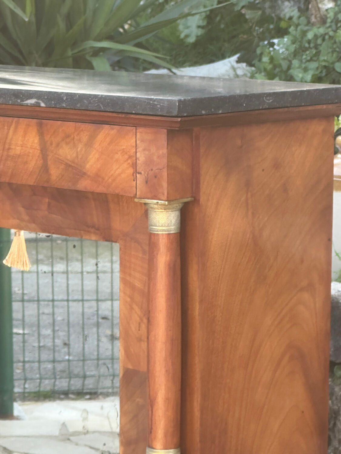 A small piece of Bonheur du jour with detached columns in Empire-era mahogany.