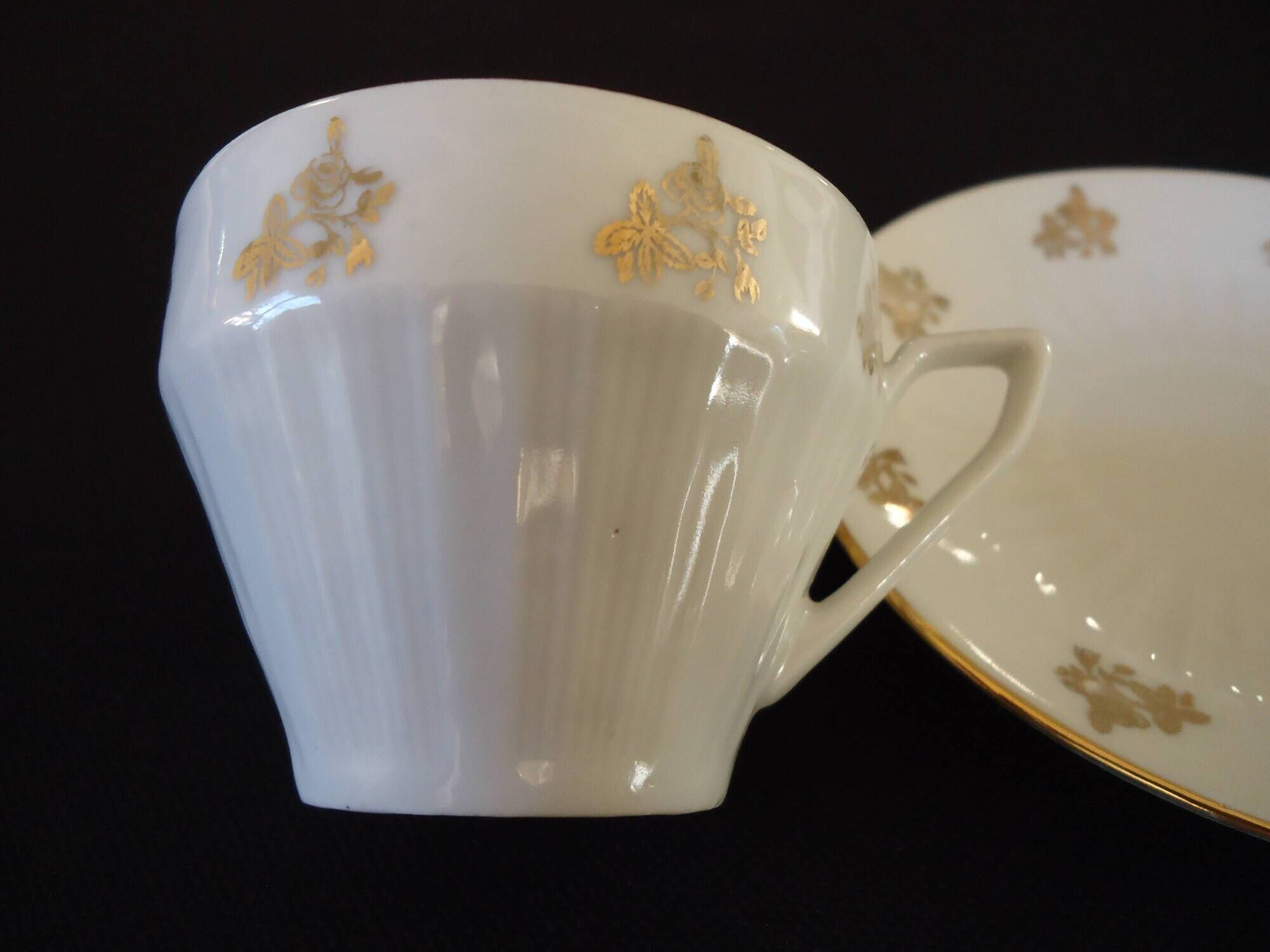 Set of six Art Deco white fine porcelain coffee cups and saucers