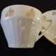 Set of six Art Deco white fine porcelain coffee cups and saucers