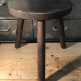Wooden milking stool on tripod base