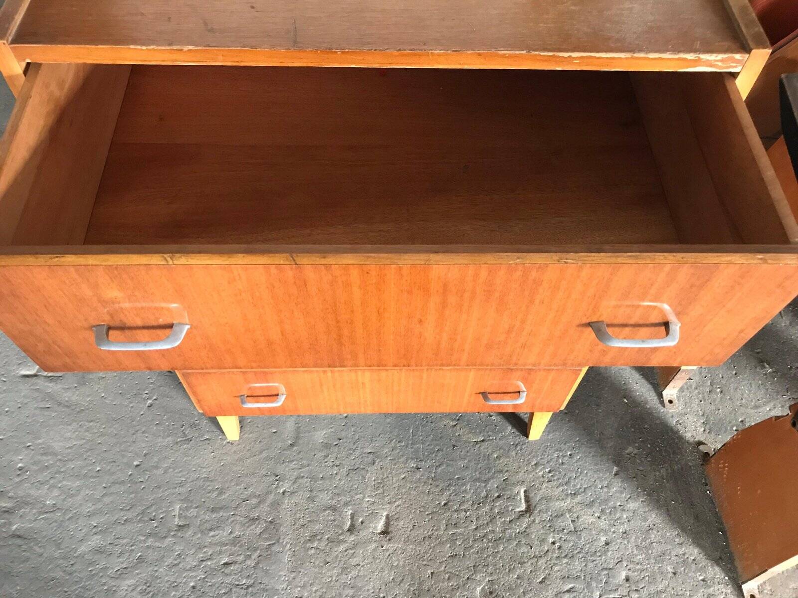 Vintage Scandinavian brown wooden chest of drawers with iron handles and 4 drawers, 1960s.