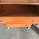Vintage Scandinavian brown wooden chest of drawers with iron handles and 4 drawers, 1960s.