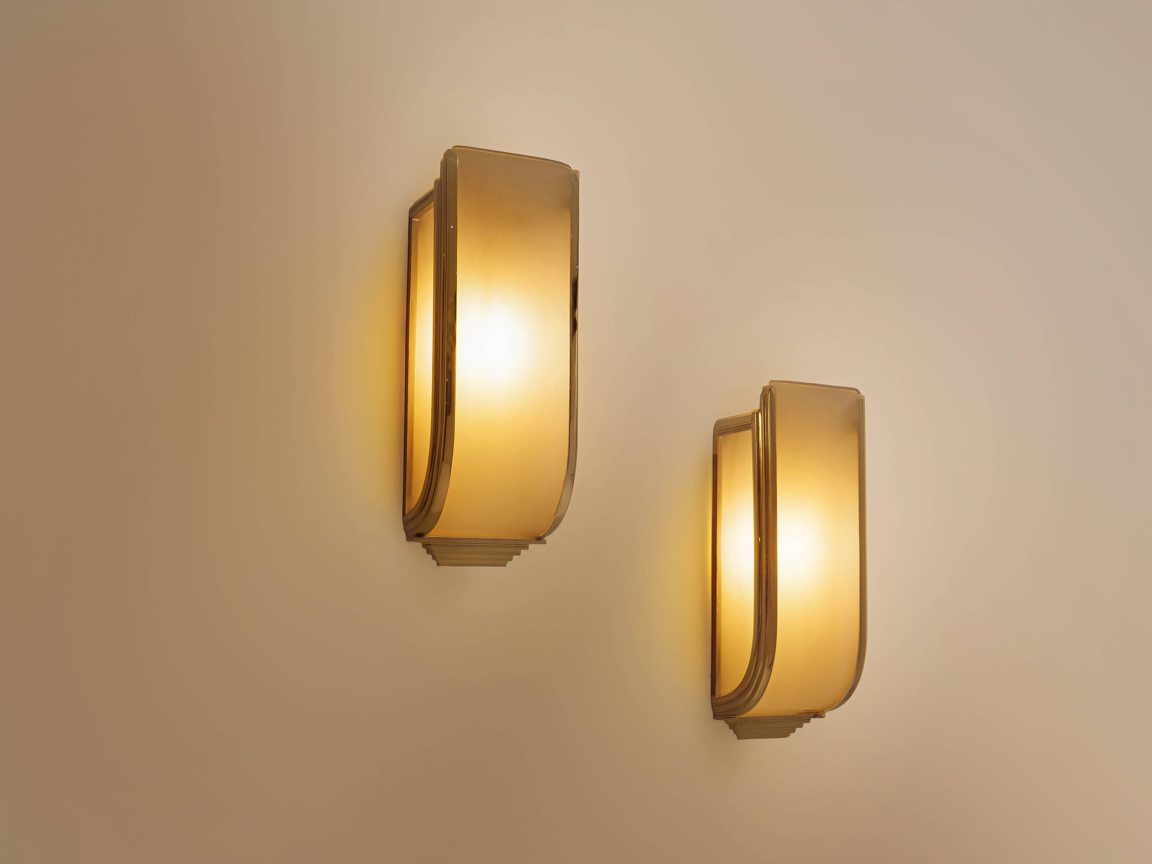 Pair of modernist wall sconces in nickel-plated steel and opaline glass, 1930.