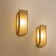 Pair of modernist wall sconces in nickel-plated steel and opaline glass, 1930.