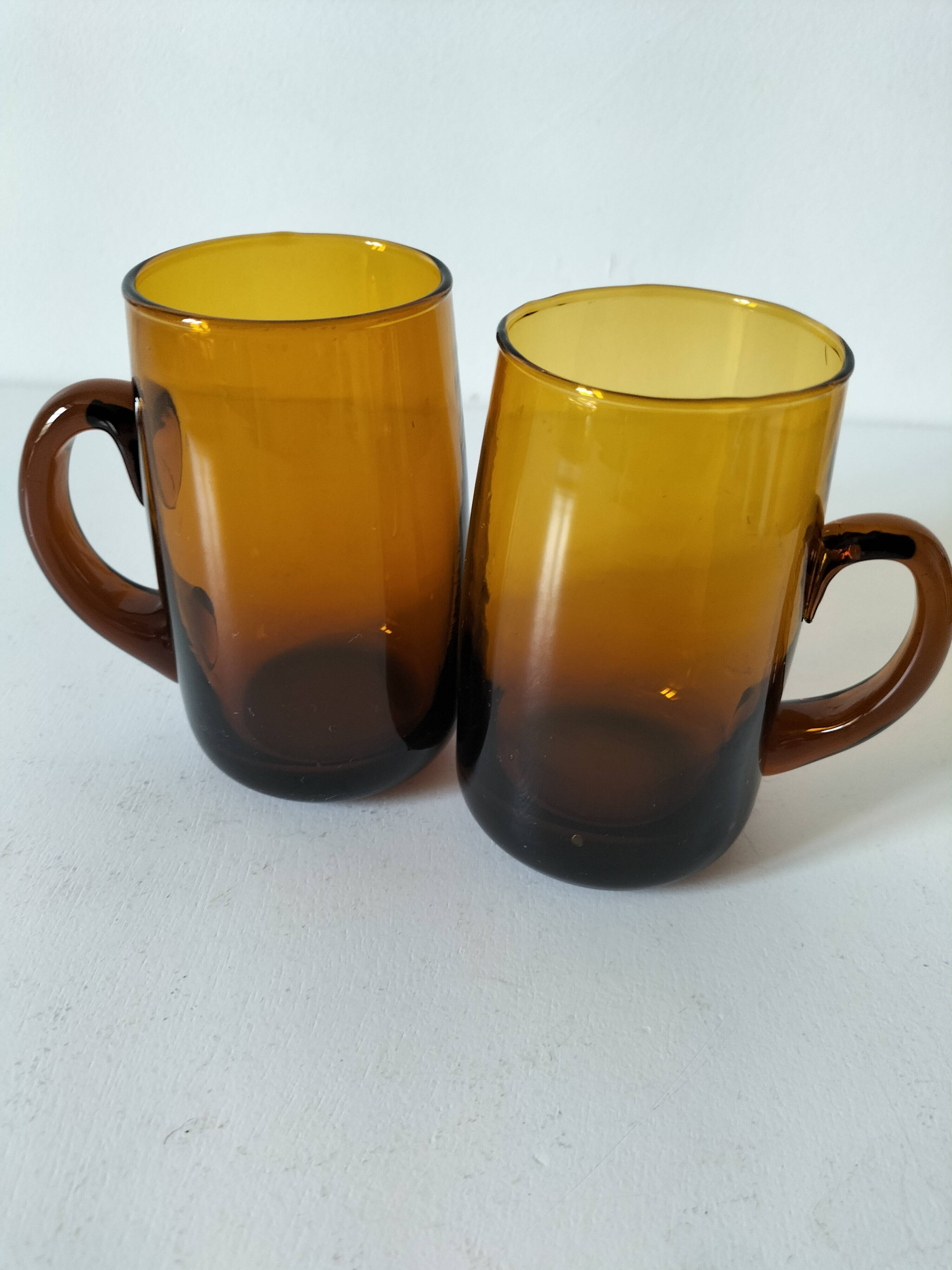 Pair of vintage amber glass tankards