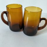 Pair of vintage amber glass tankards