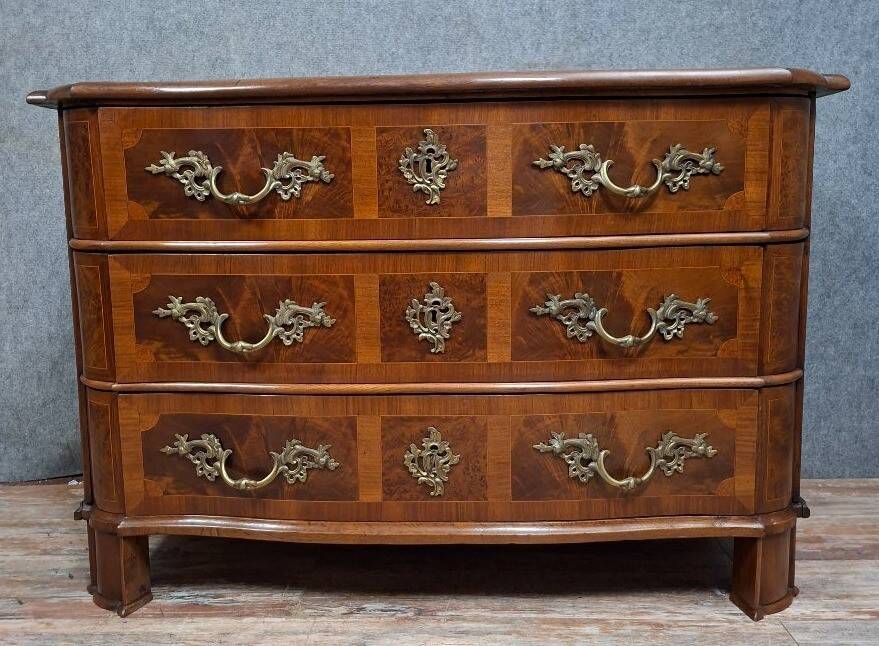 Curved commode from the Louis XIV period in marquetry - adorned with gilded bronze fittings.
