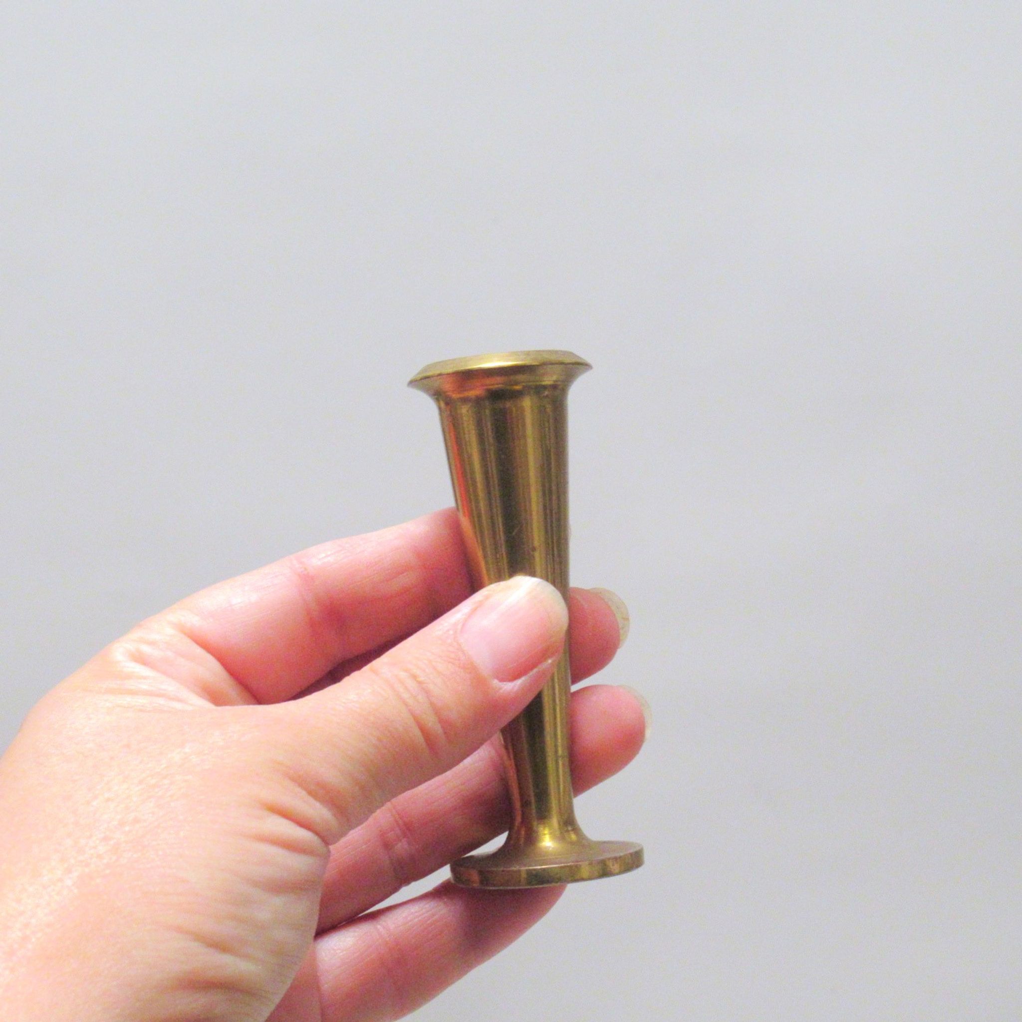 Five scandinavian brass candle holders 60s