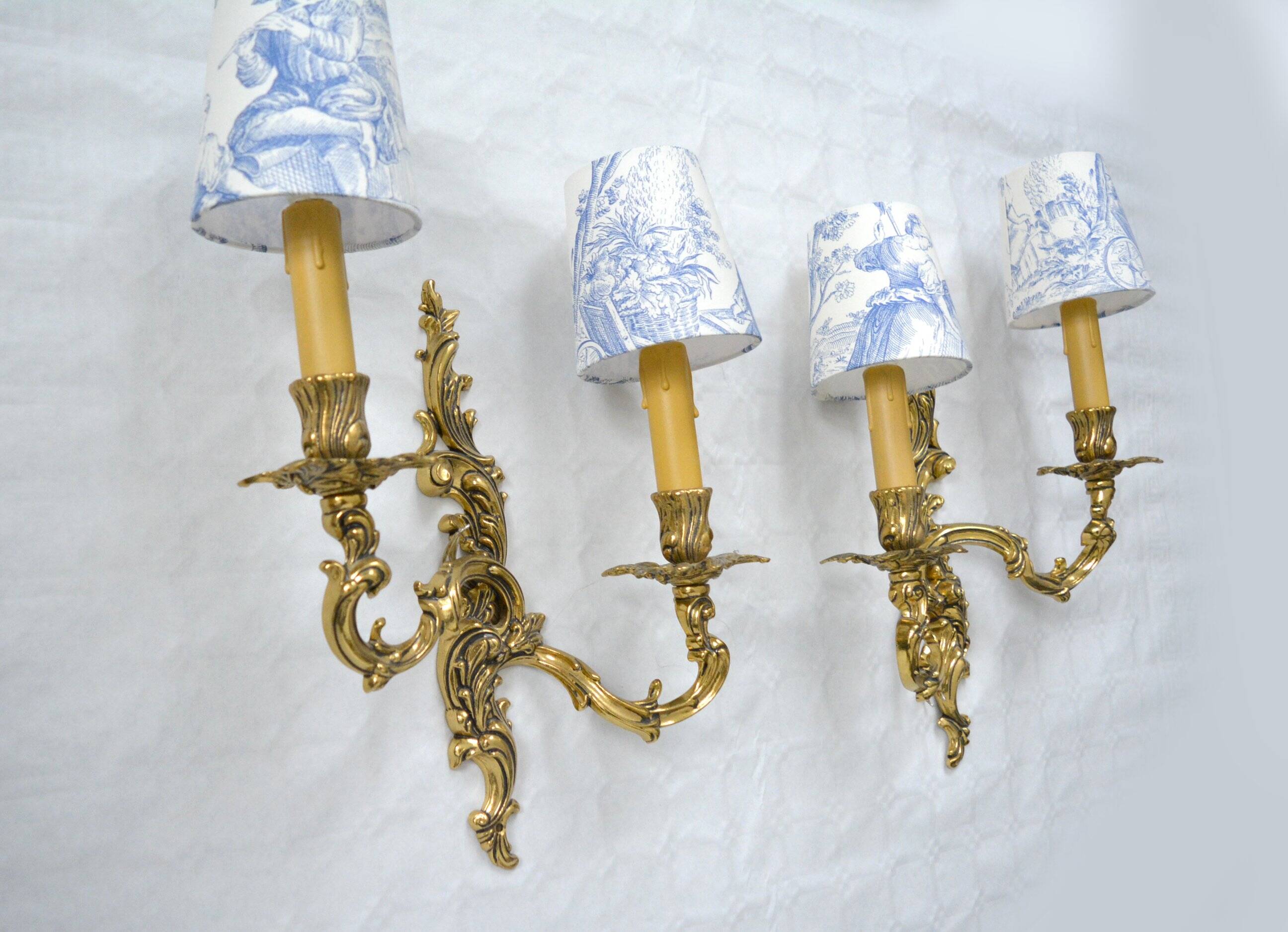 2 brass wall lights with toile de jouy lampshades