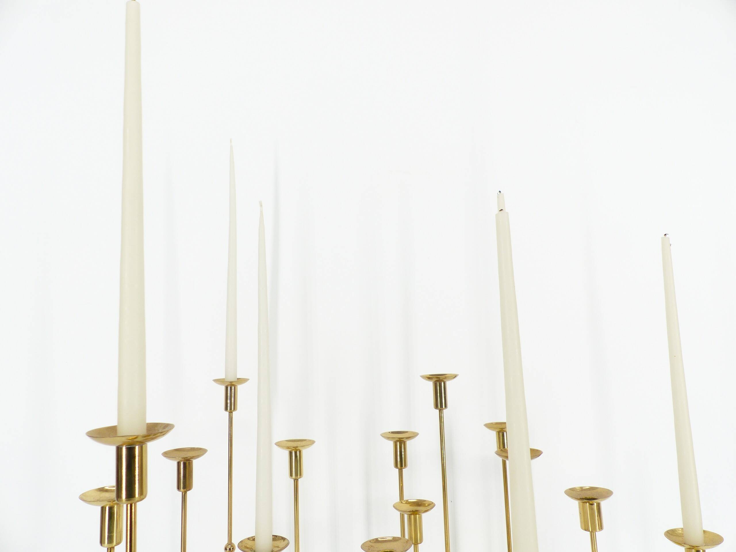 Set of 15 Scandinavian candle holders in brass and glass, Gunnar Ander, Ystad Met