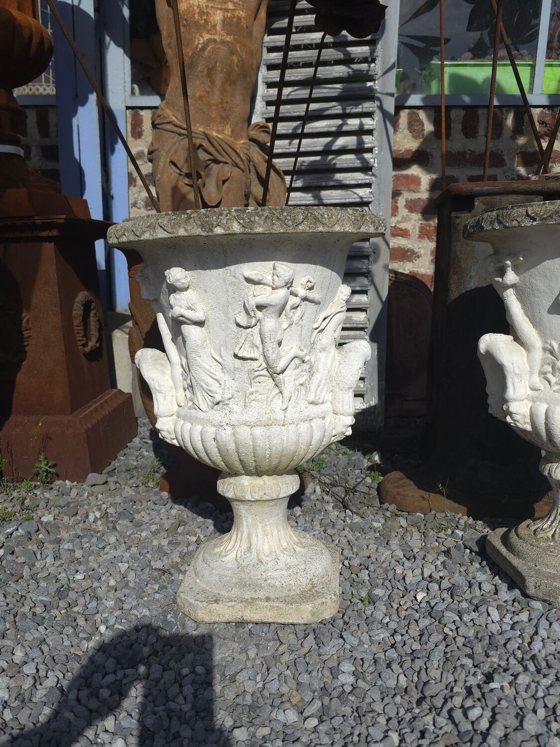 Medical vases with characters in reconstituted stone.