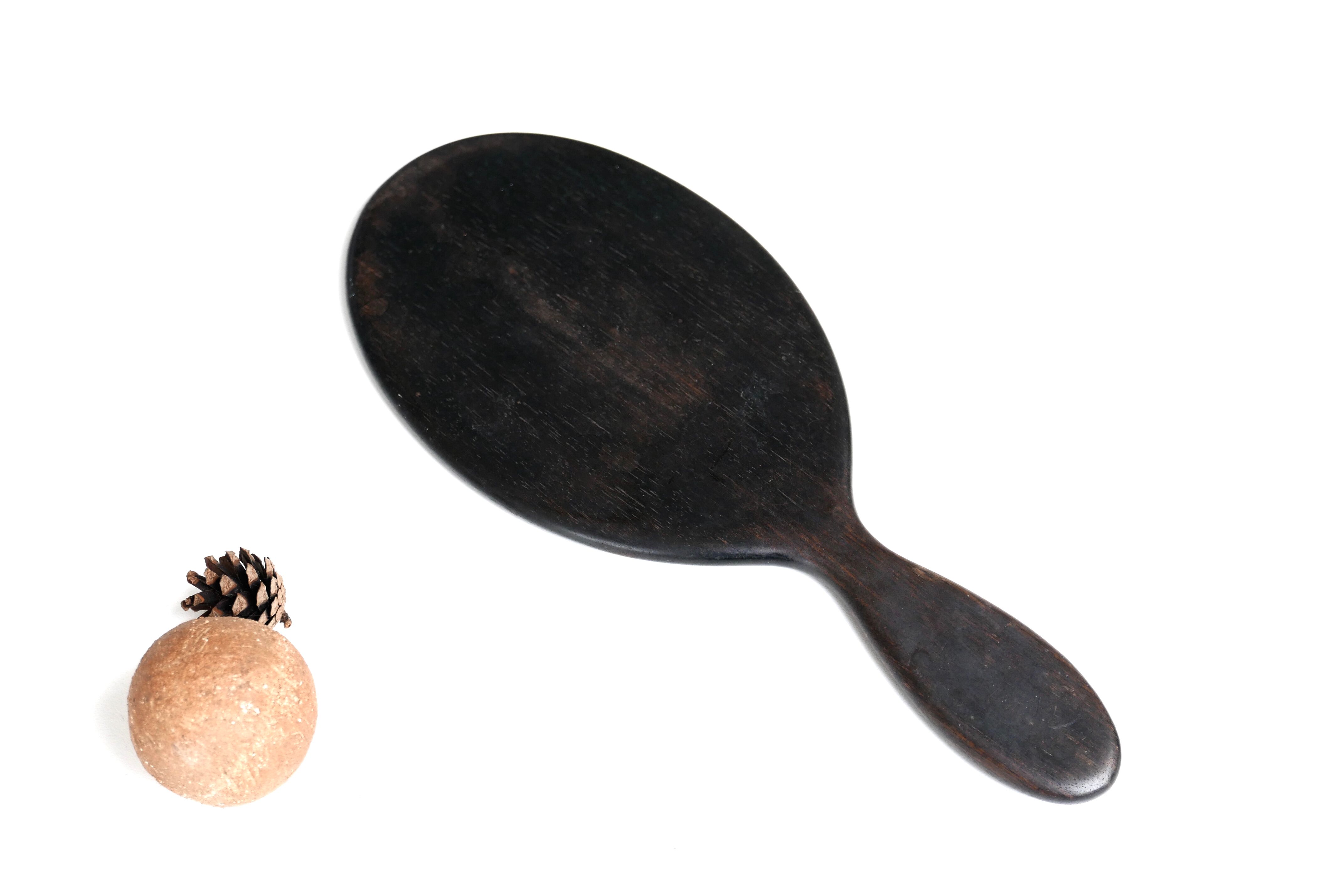 Napoleon III bevelled hand mirror in ebony, 30.5 x 13 cm